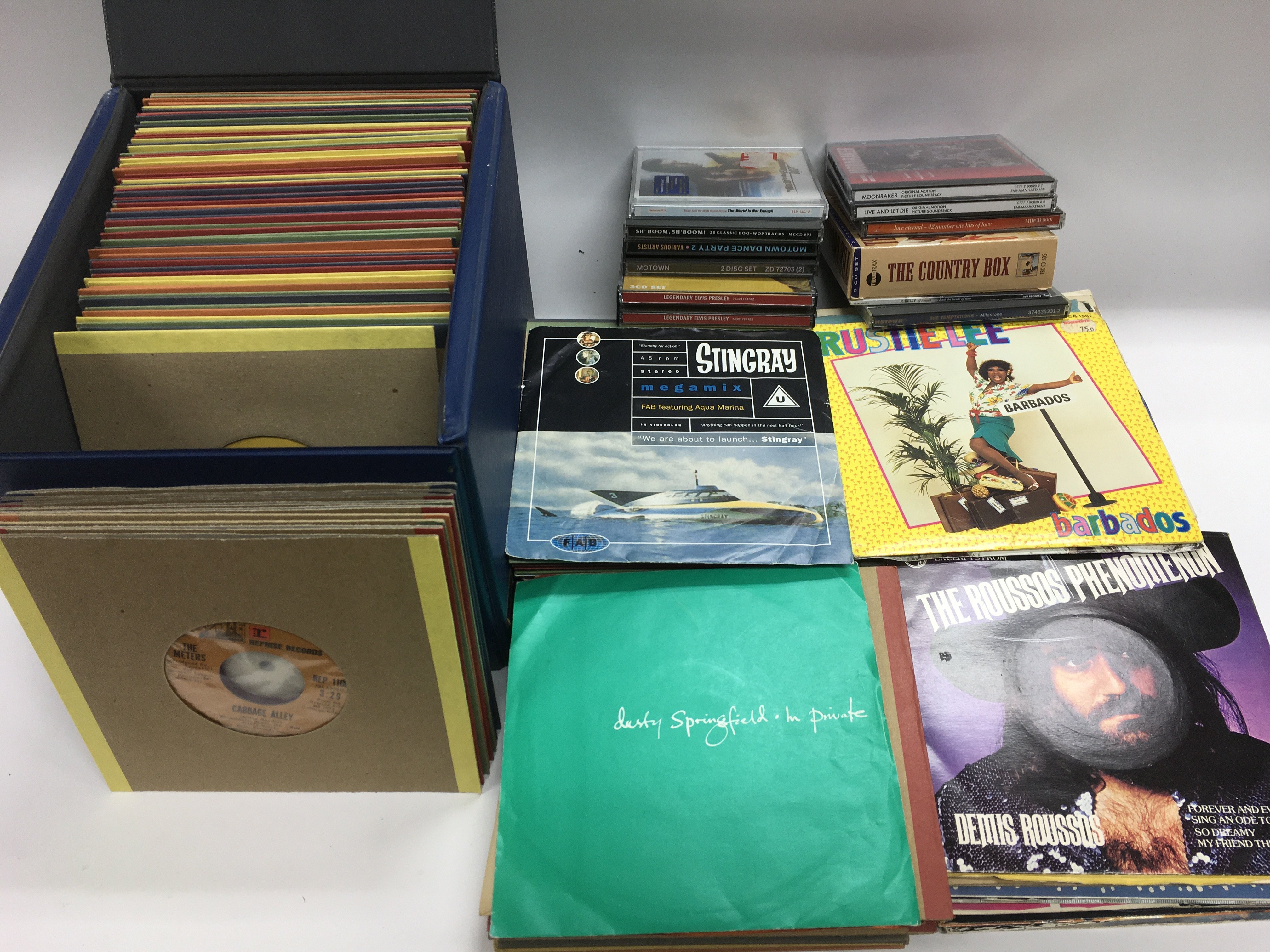 Two record cases of 7inch singles and CDs by vario