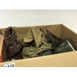 A box containing military items and other oddments