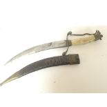 An Indian daggers with bone handle brass mounts an