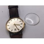 A Gents gold cased Automatic Garrard watch with date aperture engraved back plate not seen working.