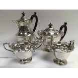 A four piece silver tea and coffee service with piercework decoration, Birmingham hallmarks.