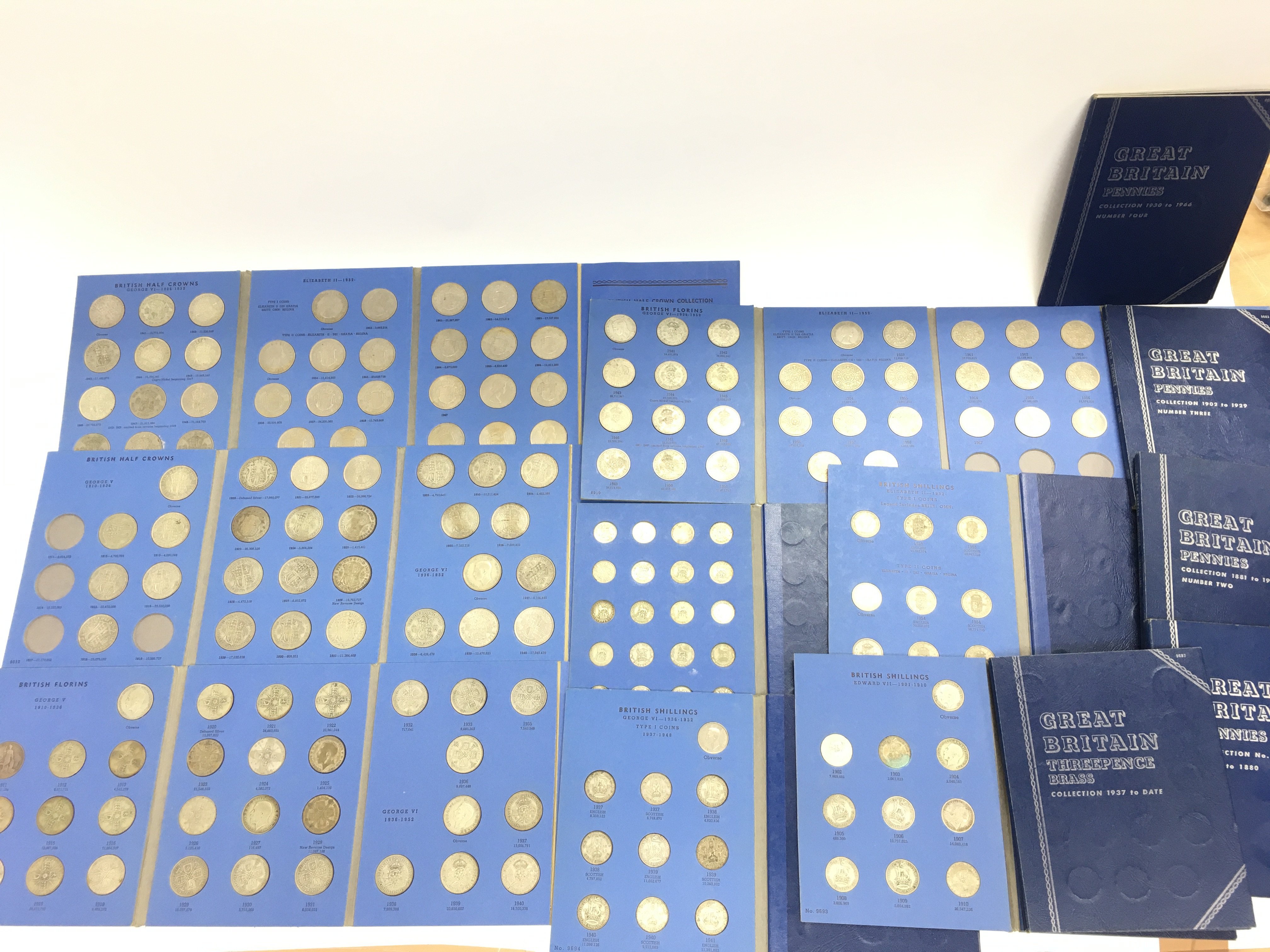 A collection of various British blue coin albums m
