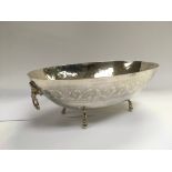 A silver two handled oval footed dish, approx leng
