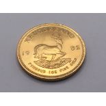 A 1982 gold krugerrand weight 33.99g approximately
