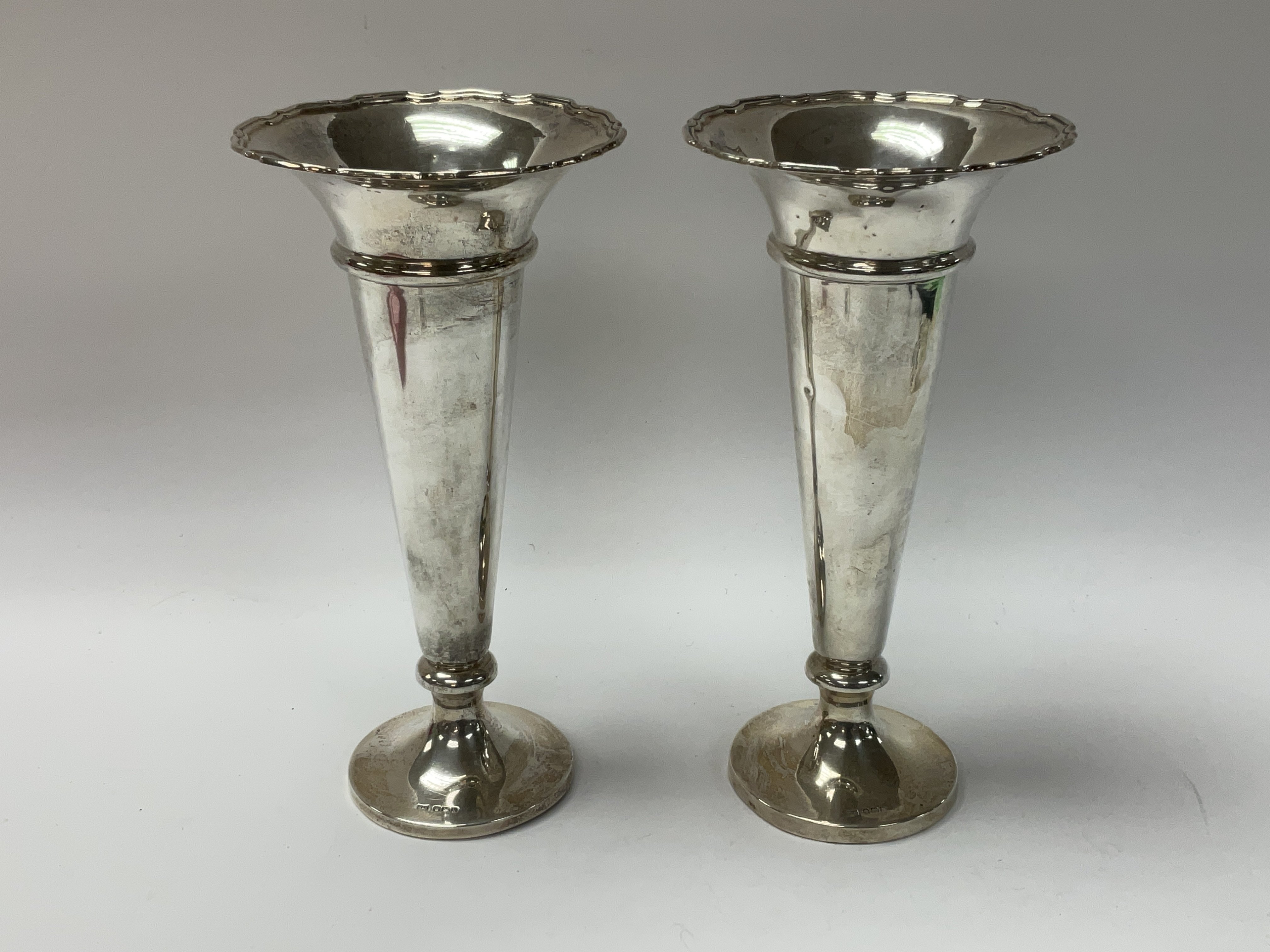 A pair of hallmarked silver fluted vases. H.20.5cm
