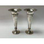 A pair of hallmarked silver fluted vases. H.20.5cm