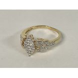 A Marquise shaped Diamond cluster ring in 14ct Gol