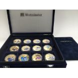 A cased set of gold plated Royal Commemorative 50