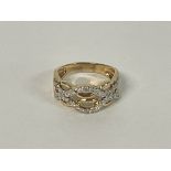 A modern style 14ct Gold multi diamond set ring. S