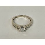 A Cartier styled Diamond set ring in White Gold, N