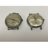2 vintage chrome plated vintage watches including a Titan and a Certina.