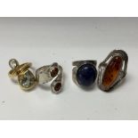 4 good silver and stone set rings.