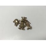 2 9ct gold clown pendants + 1 9ct frog. Approx wei