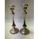 A pair of heavy (Filled) hallmarked silver candles