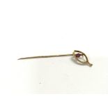 A pink tormaline gold stickpin. 1.36g