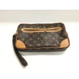 A Louis Vuitton monogram clutch bag. Overall good