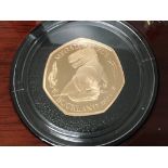 A gold proof 50p megalosaurus 2020 proof coin .