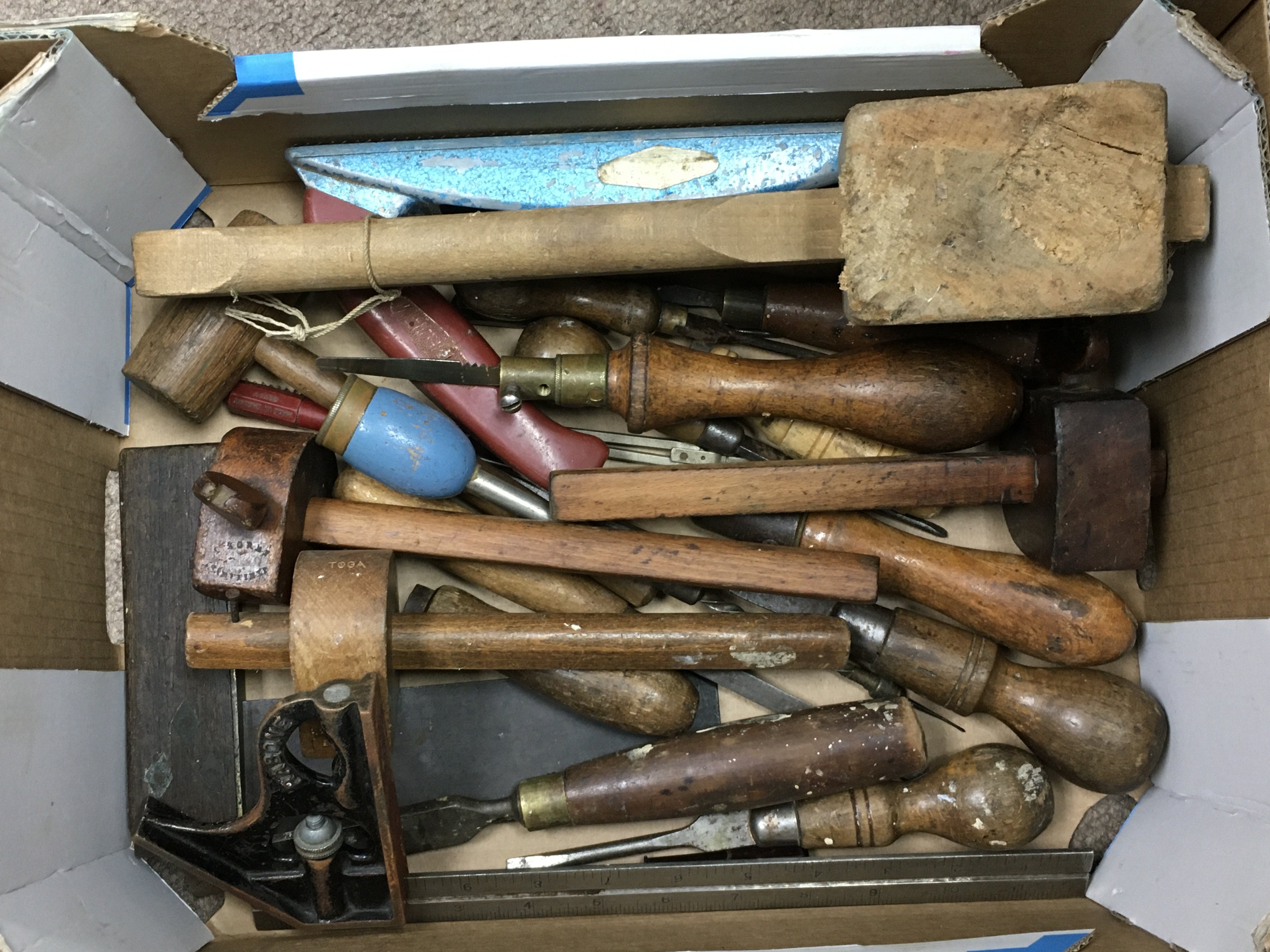 A small box of mixed woodworking tools.