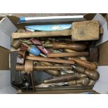 A small box of mixed woodworking tools.