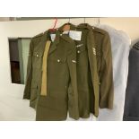 3 Replica Army outfits together with a military is