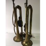 Two military brass bugles with attached tassel bot