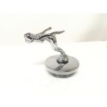 A Vintage chrome car mascot with chrome radiator c