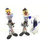 Two coloured glass Murano clowns and a Murano fish