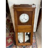 A 1940s oak wall clock with Jay Ferers movement.