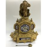A giltwork 8 day mantle clock with painted porcela