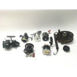 Collection of various fishing reels and scales.