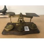 A brass collection of scales and smoker set. Smoke