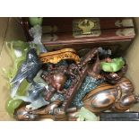 A box of mainly carved Oriental figures.