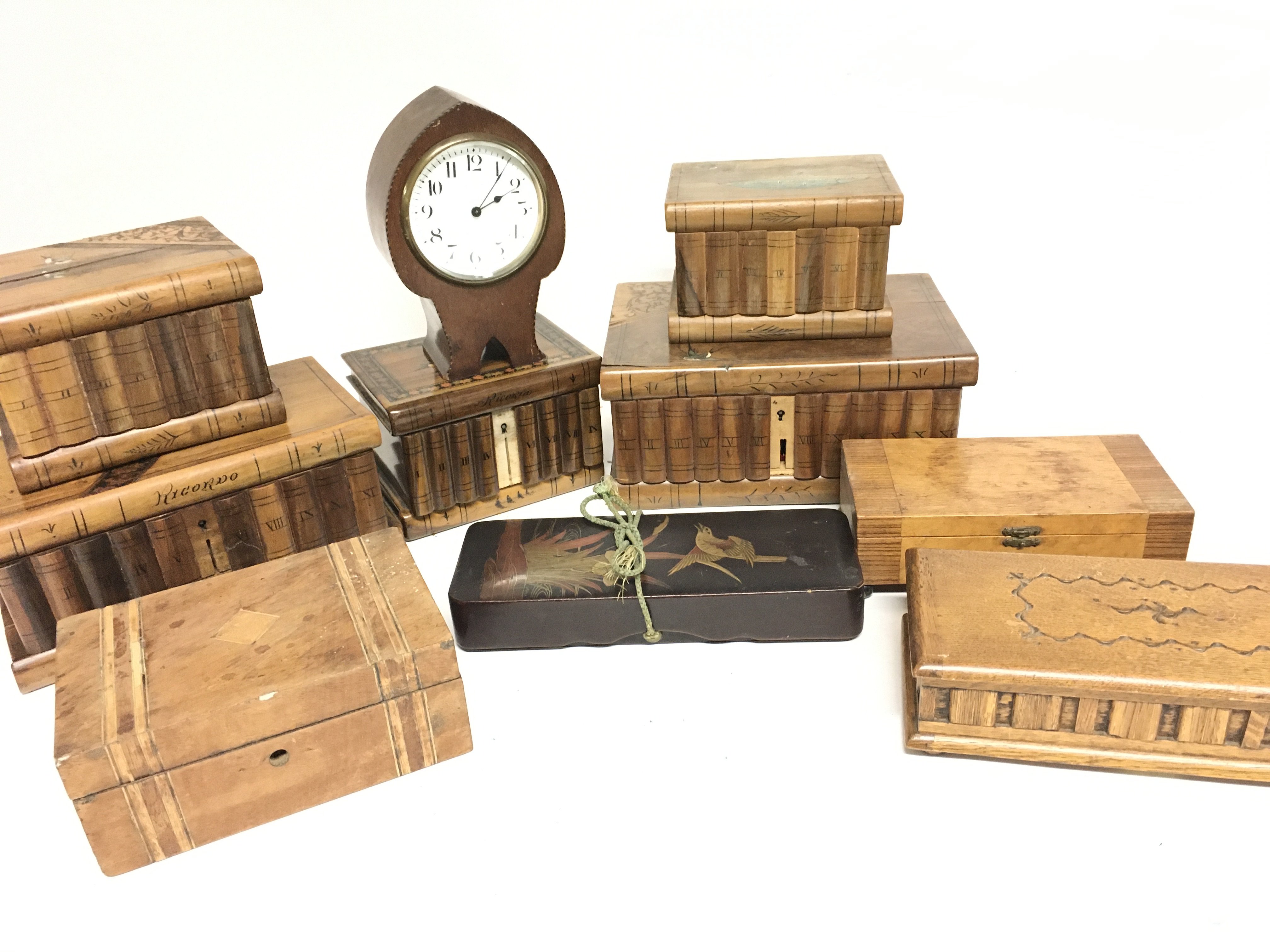 A Collection of Wooden Trinket Boxes and a Clock.