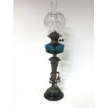 Victorian oil lamp with unusual base, blue glass r