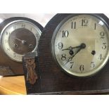 A collection of four oak mantle clocks with Arabic