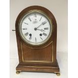 A mahogany mantle clock with an enamel dial and br