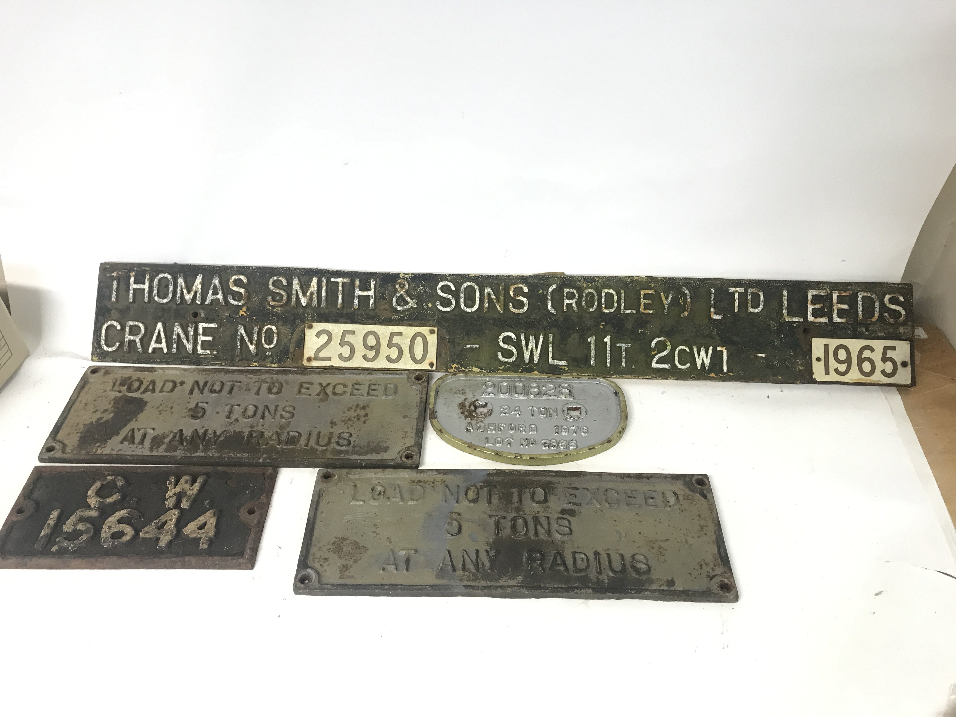 Five cast iron crane and train signs