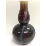 A Sang de boeuf double gourd vase, approx height 3