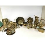Brass ware including plates, jugs, dishes, urns.