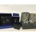 Four boxed Swarovski pieces including SCS Jubilee