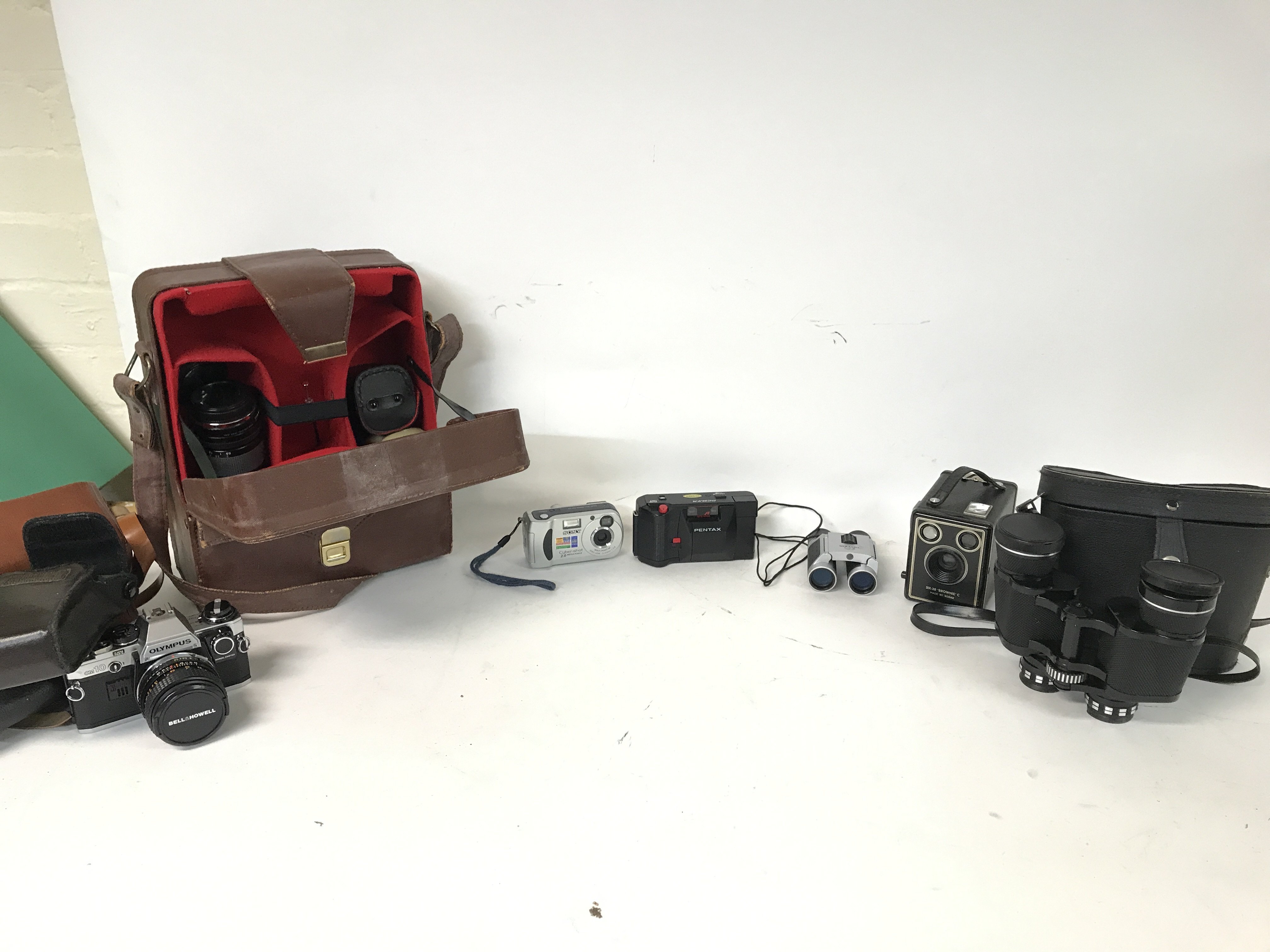 Cased cameras including an Olympus OM10, A Sony Cy