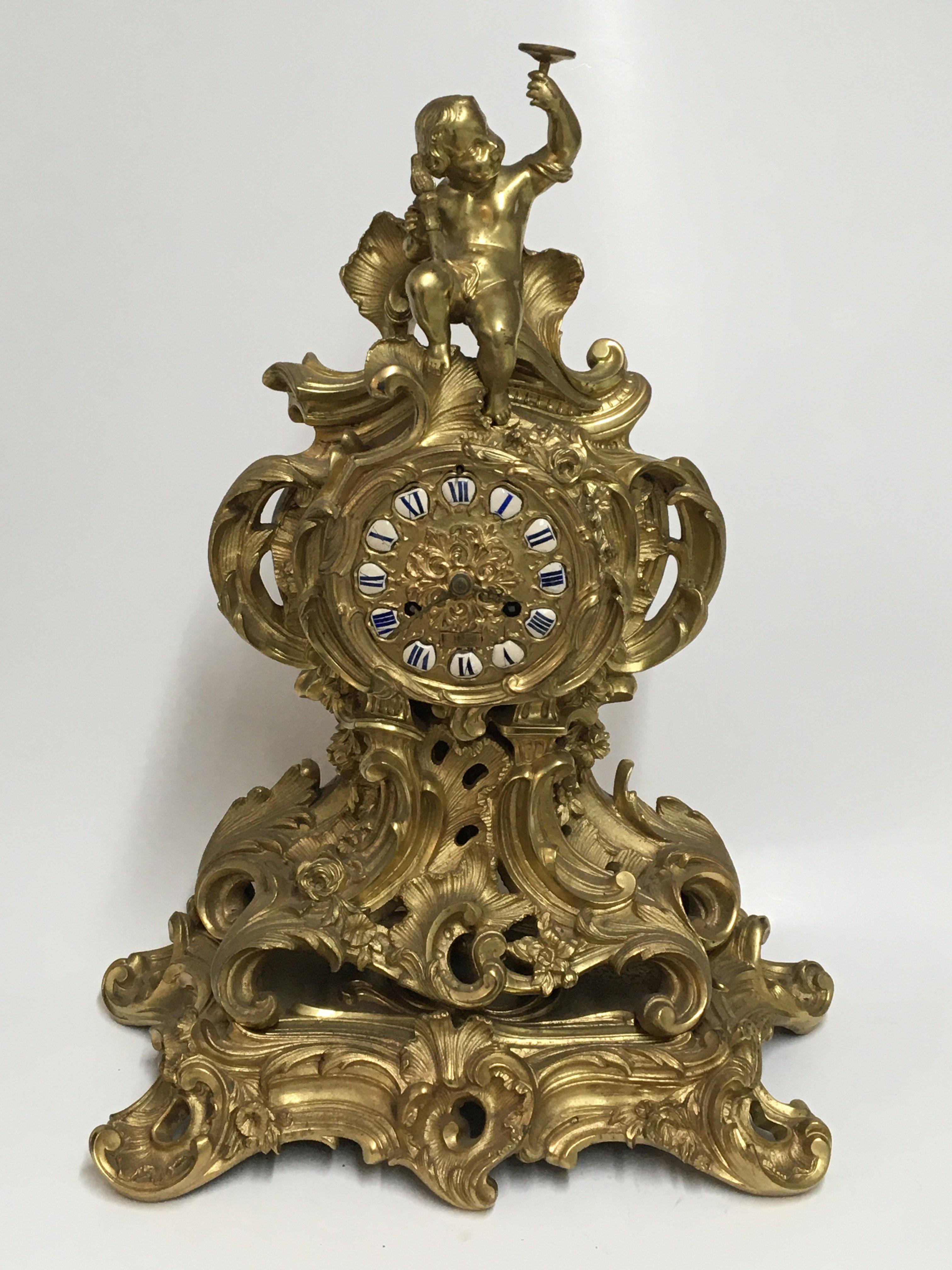 An impressive gilt bronze rococo style clock with