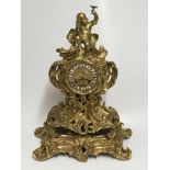 An impressive gilt bronze rococo style clock with