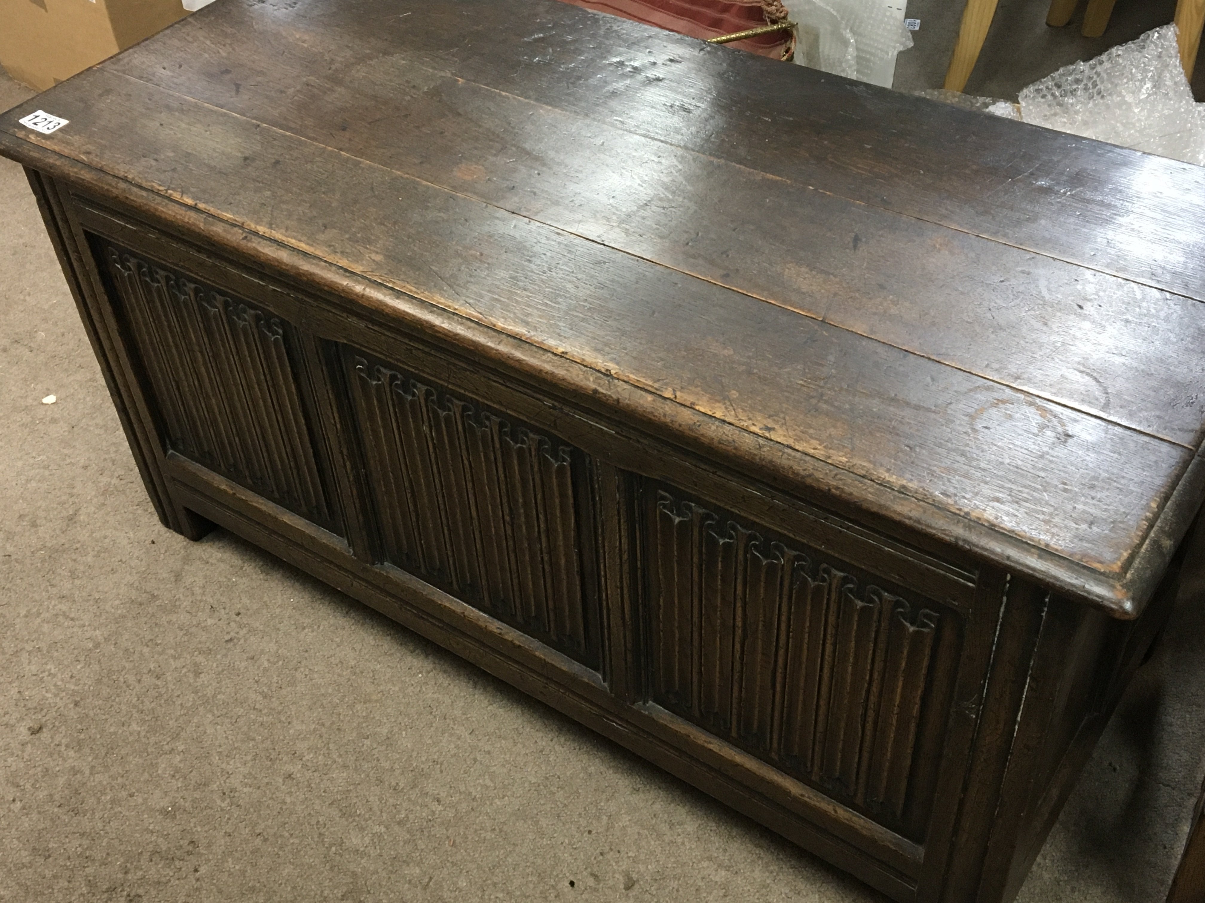 An oak trunk with linenfold front panels. 107x47cm