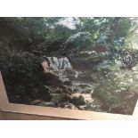 A framed watercolour depicting a stream. By John C