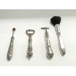 Four silver handled items including razor - brushe