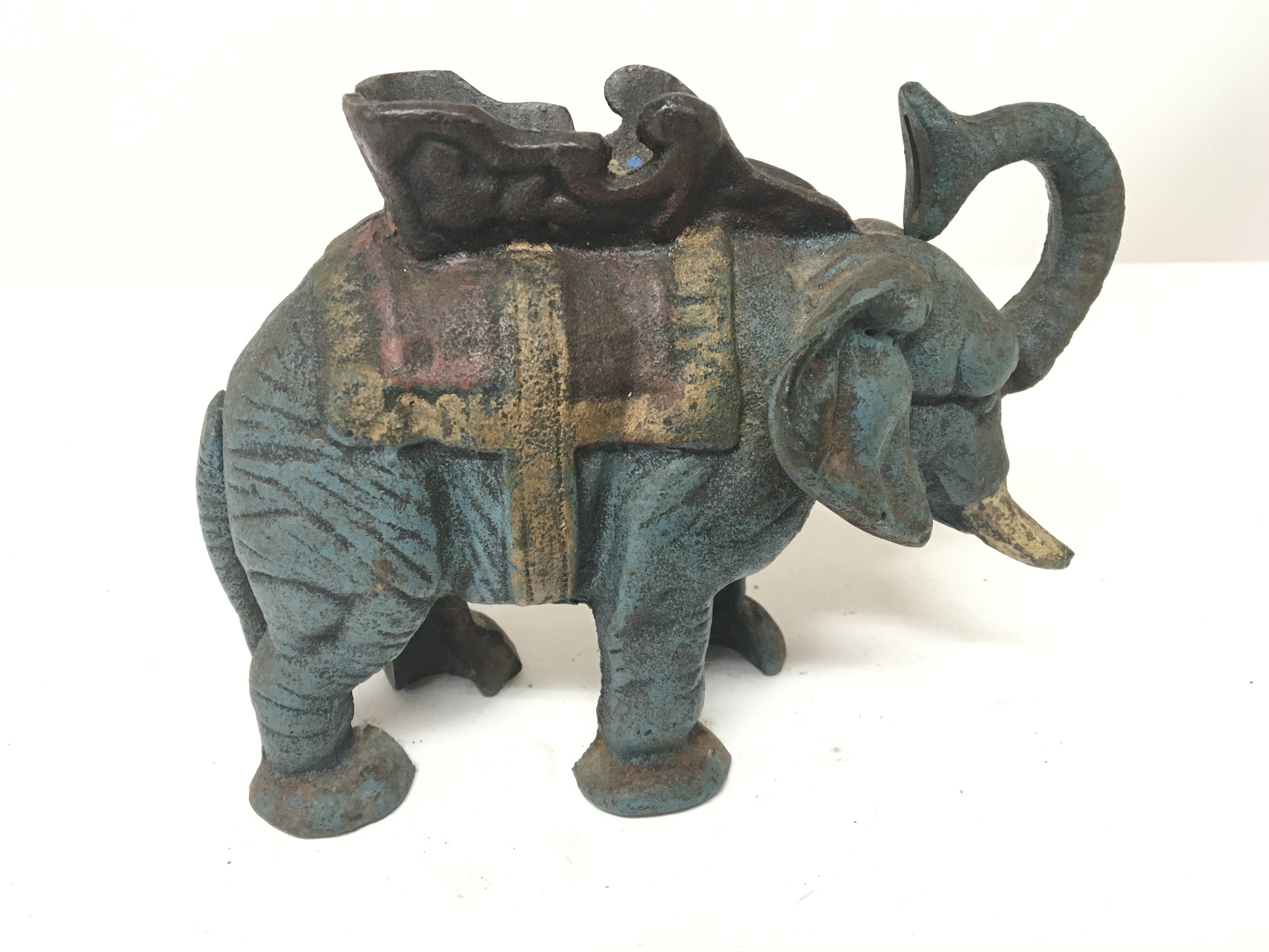 A reproduction cast iron painted money box in the