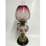 An impressive Victorian brass and cranberry glass