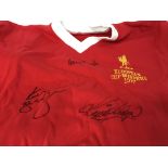 A Liverpool football shirt signed Kenny Dalglish ,