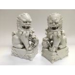 Two dogs of Fo blanc de chine figures, approx heig